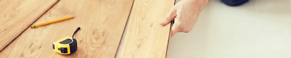 A professional installing wood flooring in San Francisco, CA