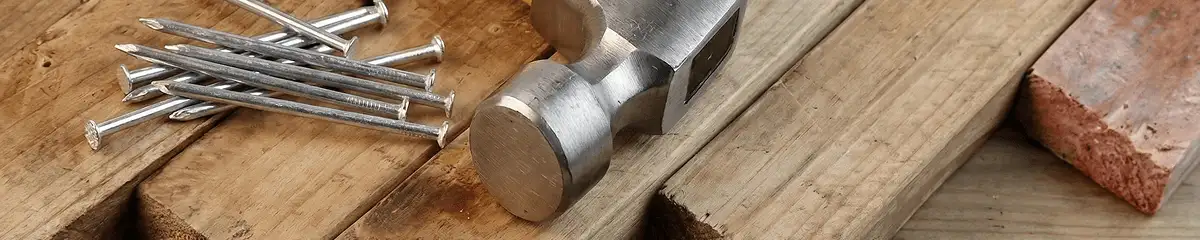 Hammer and nails on hardwood flooring boards in San Francisco, CA