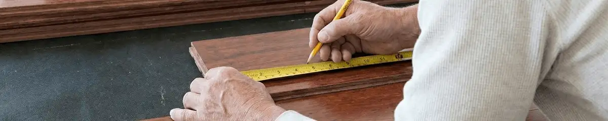 A professional installing wood flooring in San Francisco, CA